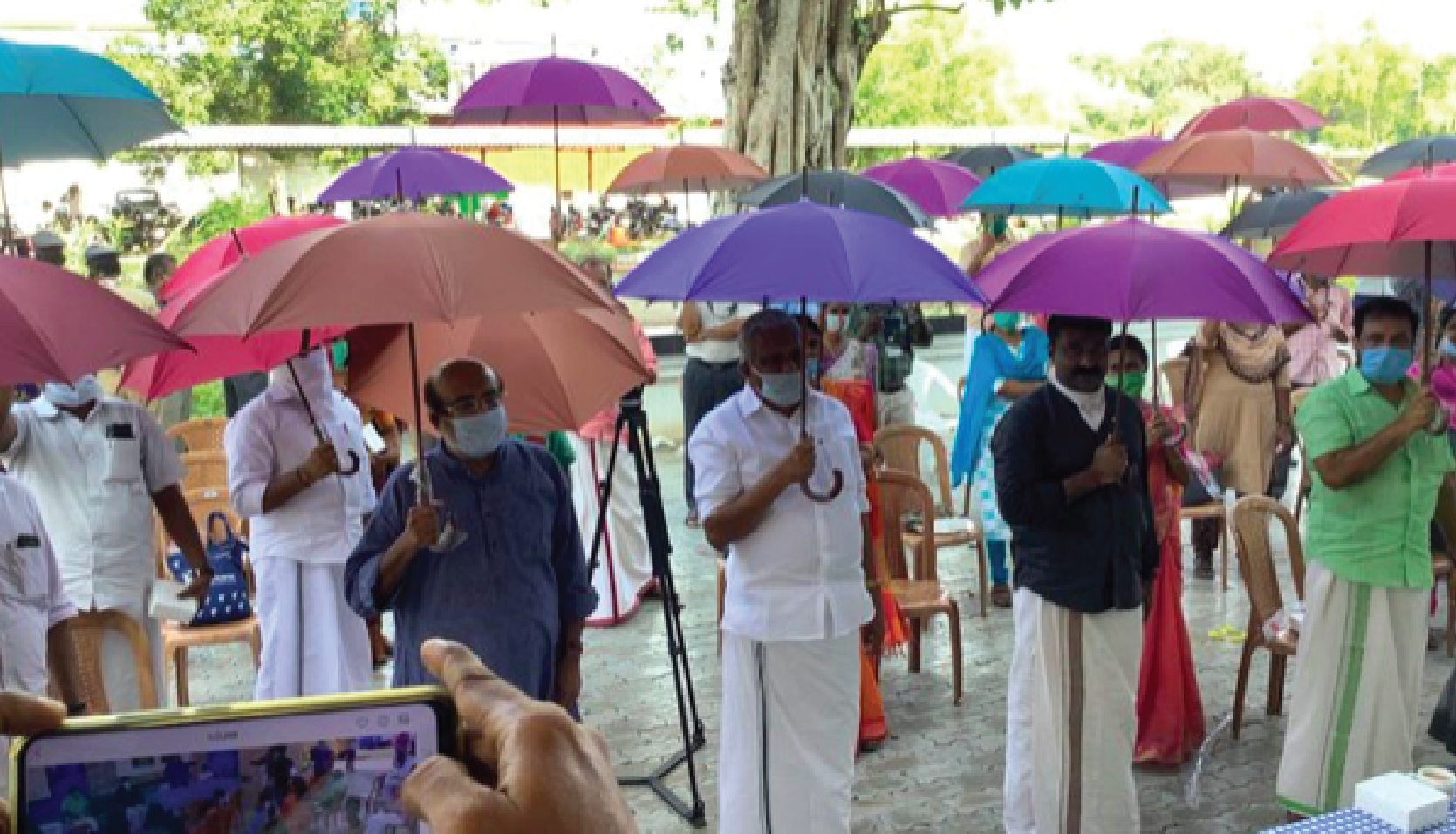 India (several states): Two opened umbrellas provide shade and will ensure a minimum distance of 1 meter between two people